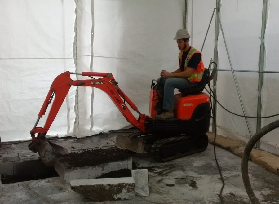 Excavation of a drainage system with an electric shovel